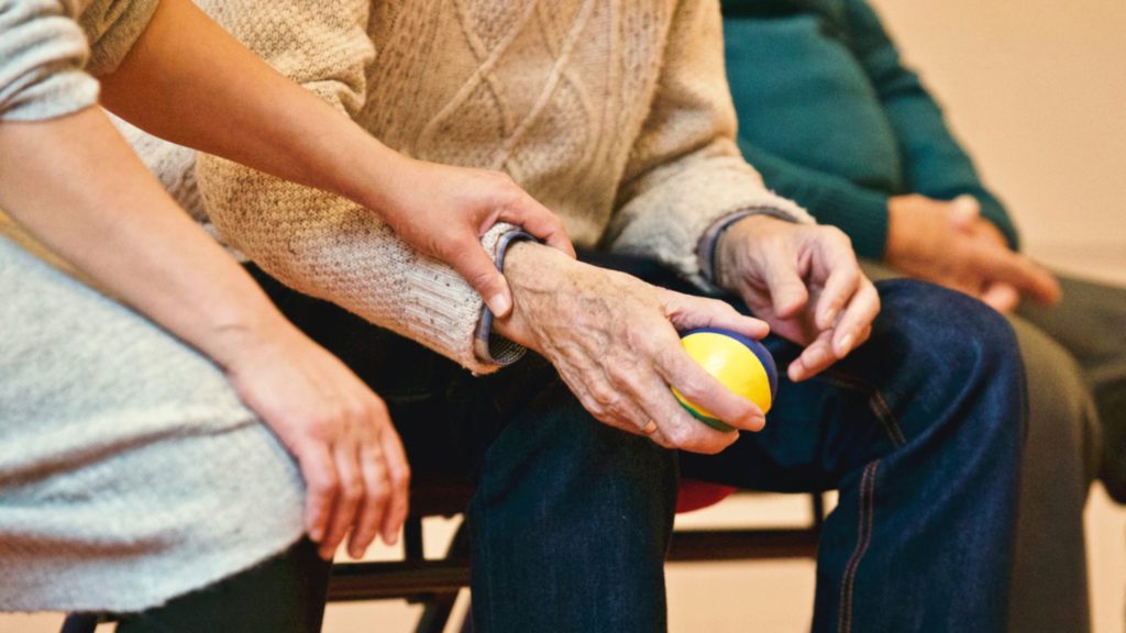 image of patient holding stress ball