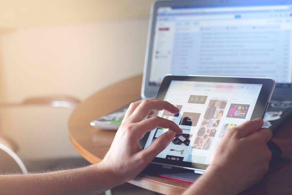 image of hands using a touchscreen