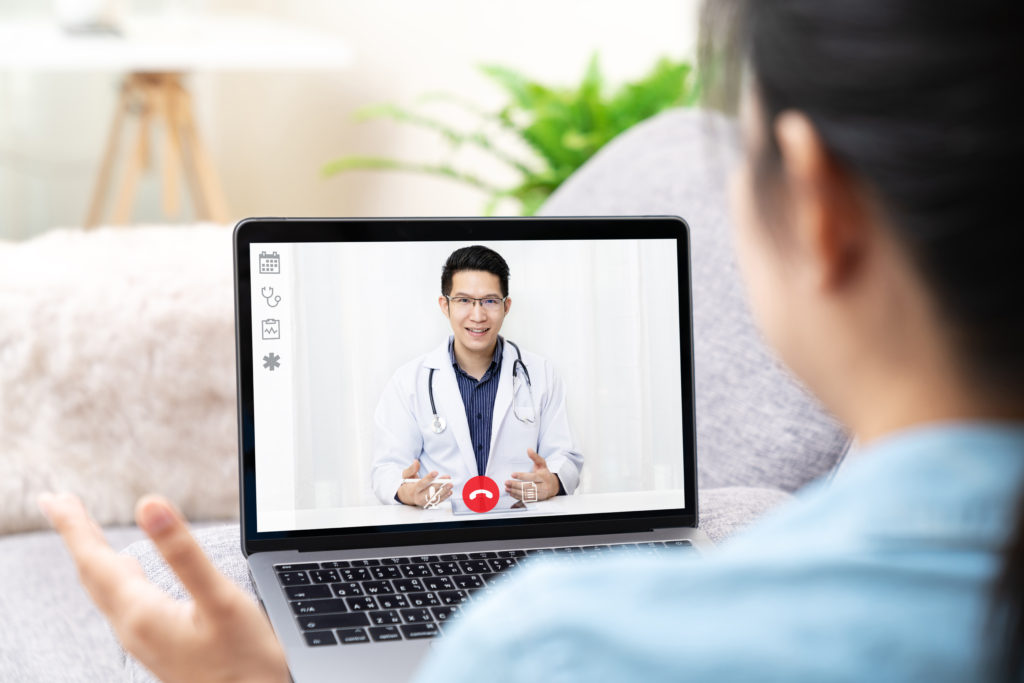 Asian chinese doctor video conference call online talking
