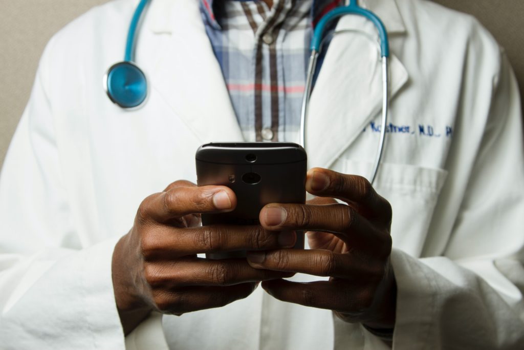 image of a doctor communicating on a device