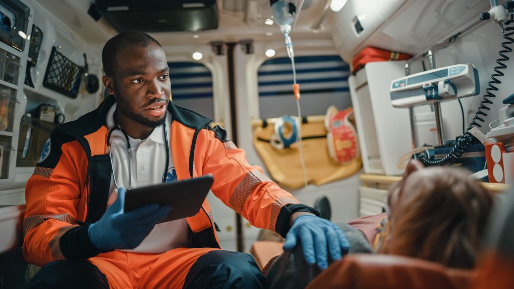 Black African American EMS Professional Paramedic Using Tablet